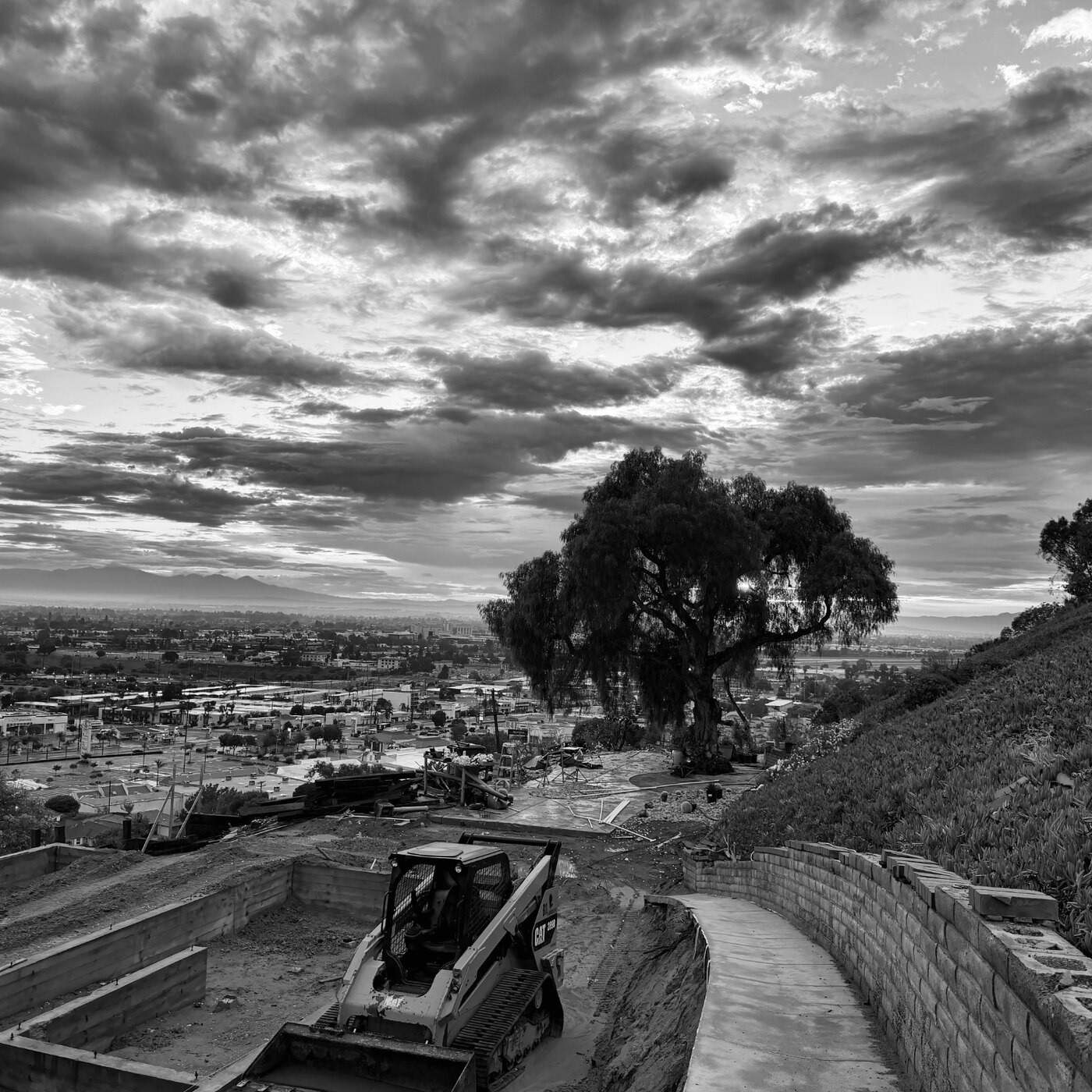 Wide hillside construction site with grading equipment at 4501 Via Corona