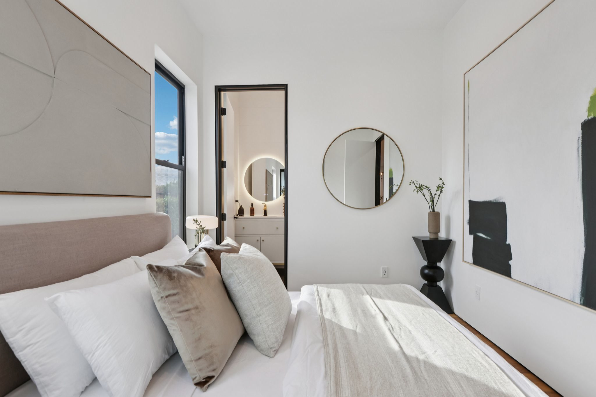 Guest bedroom suite with a direct view into its private bathroom
